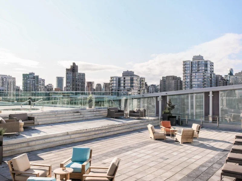 Rooftop spa terrace with lounge seating and open skyline outlook