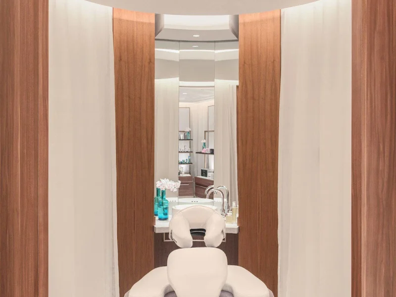 Private spa treatment chair in a serene cedar-framed nook