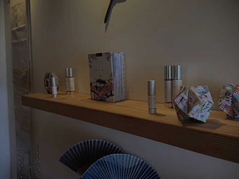 Zen spa retail shelf with decorative fans and wellness products