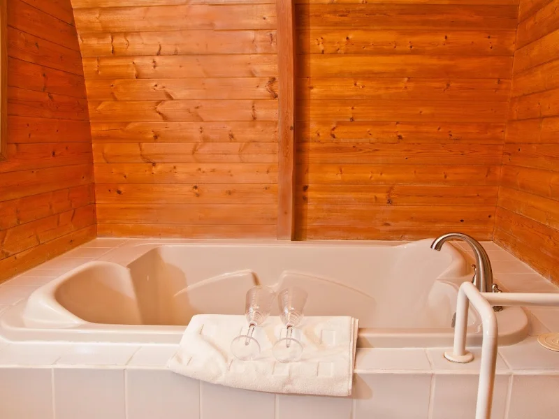 Private wooden soaking tub in a cozy cabin spa bath