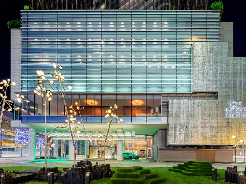 Fairmont Pacific Rim modern glass architecture illuminated against nighttime Vancouver skyline
